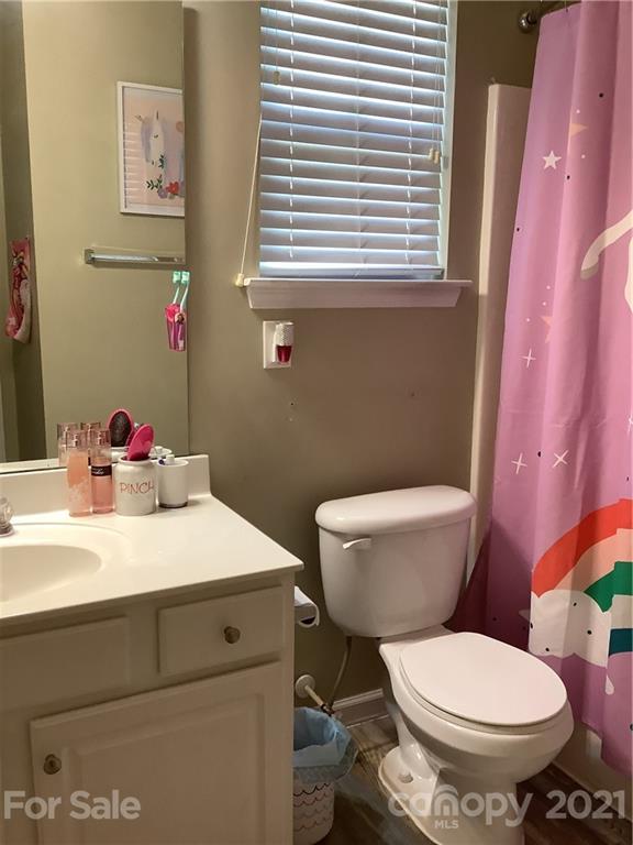 388 Sand Paver Way Fort Mill, SC 29708 - Photo 16 of 20 a bathroom with a toilet sink and mirror