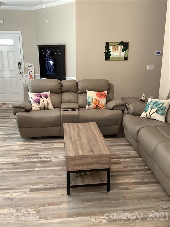 388 Sand Paver Way Fort Mill, SC 29708 - Photo 3 of 20 a living room with furniture and a wooden floor