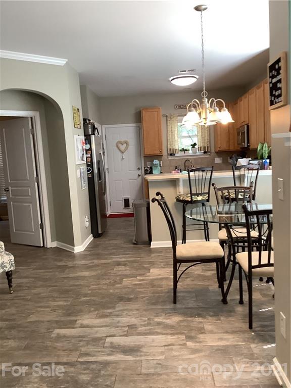 388 Sand Paver Way Fort Mill, SC 29708 - Photo 4 of 20 a view of a dining room with furniture