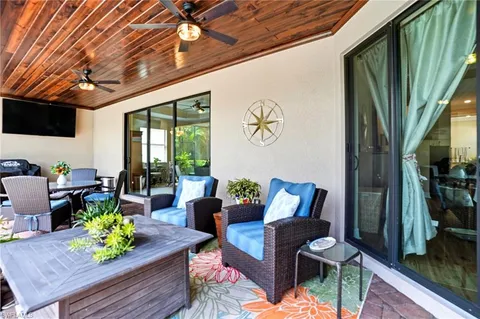 a outdoor living space with furniture and a potted plant