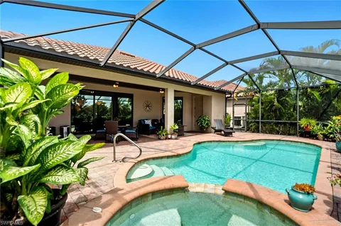 swimming pool with outdoor seating and yard