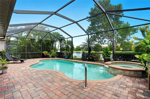 a view of a backyard with swimming pool