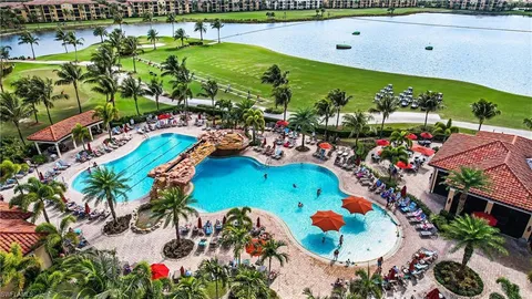 an aerial view of a swimming pool patio yard and outdoor seating