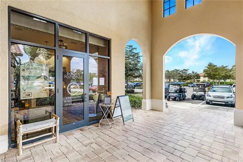 a view of a hall way with furniture