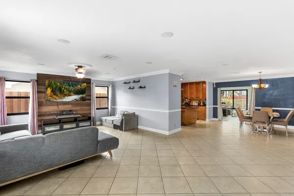 a living room with furniture and flat screen tv