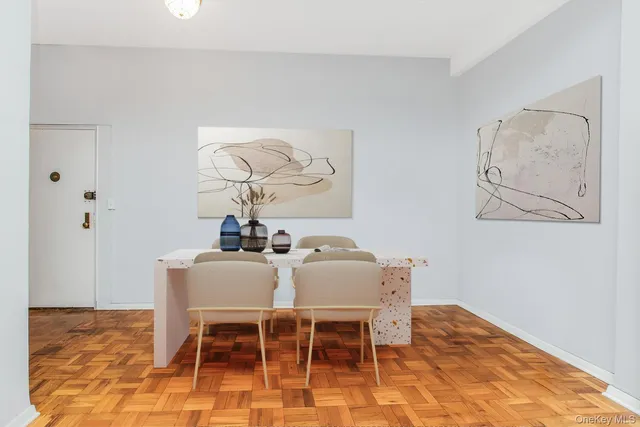 a dining room with wooden floor and breakfast area