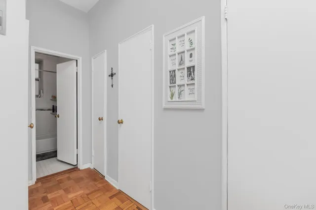 a view of room with window and wooden floor