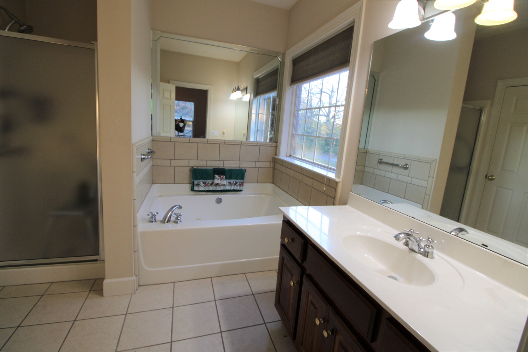 248 West Hester Road Cottontown, TN 37048 - Photo 14 of 22 a bathroom with a tub sink and mirror