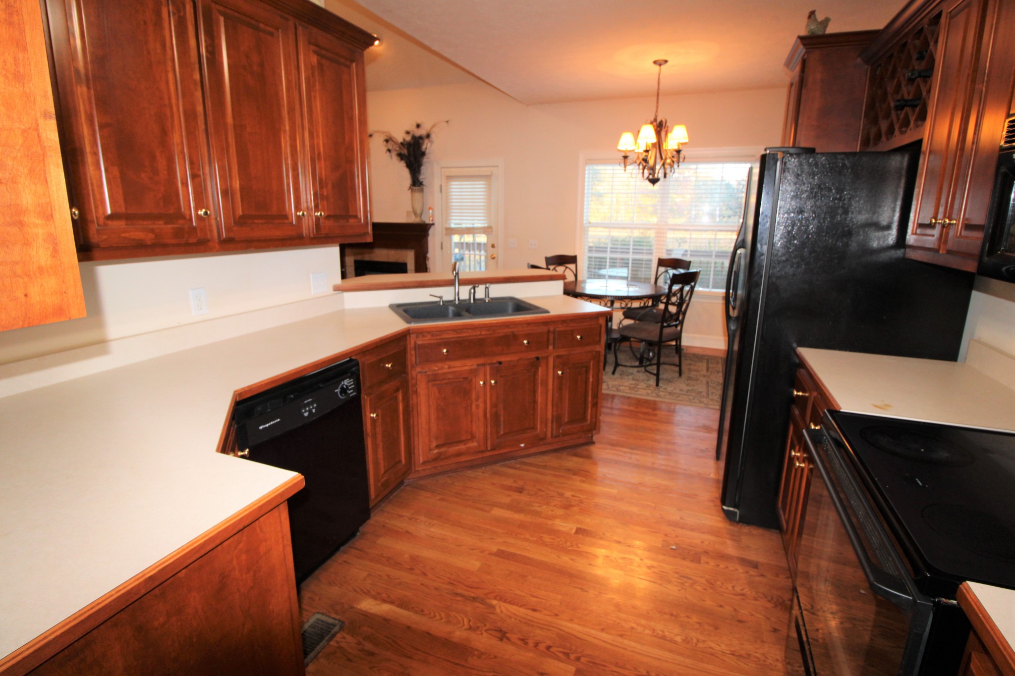 248 West Hester Road Cottontown, TN 37048 - Photo 8 of 22 a kitchen with stainless steel appliances granite countertop a sink a stove and a refrigerator