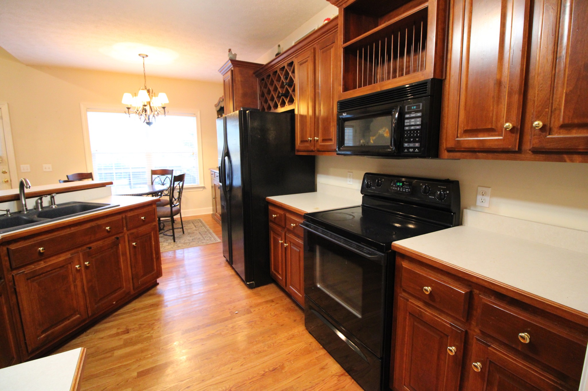 248 West Hester Road Cottontown, TN 37048 - Photo 9 of 22 a kitchen with stainless steel appliances granite countertop a stove a sink and a microwave