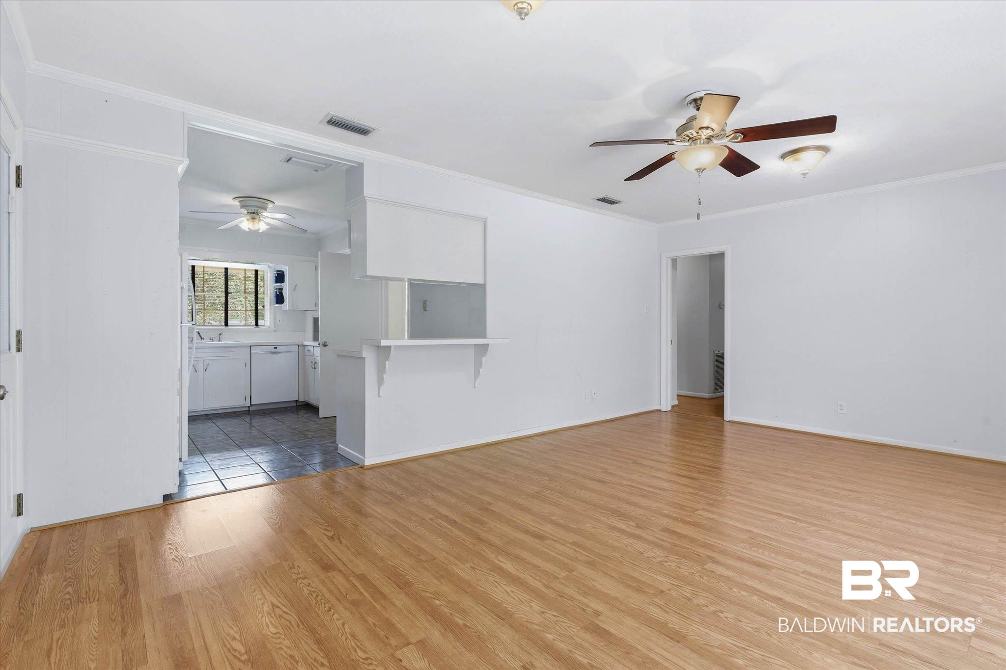 1182 Ginger Drive Mobile, AL 36693 - Photo 16 of 37 Bright living area featuring wood-finish flooring and a ceiling fan