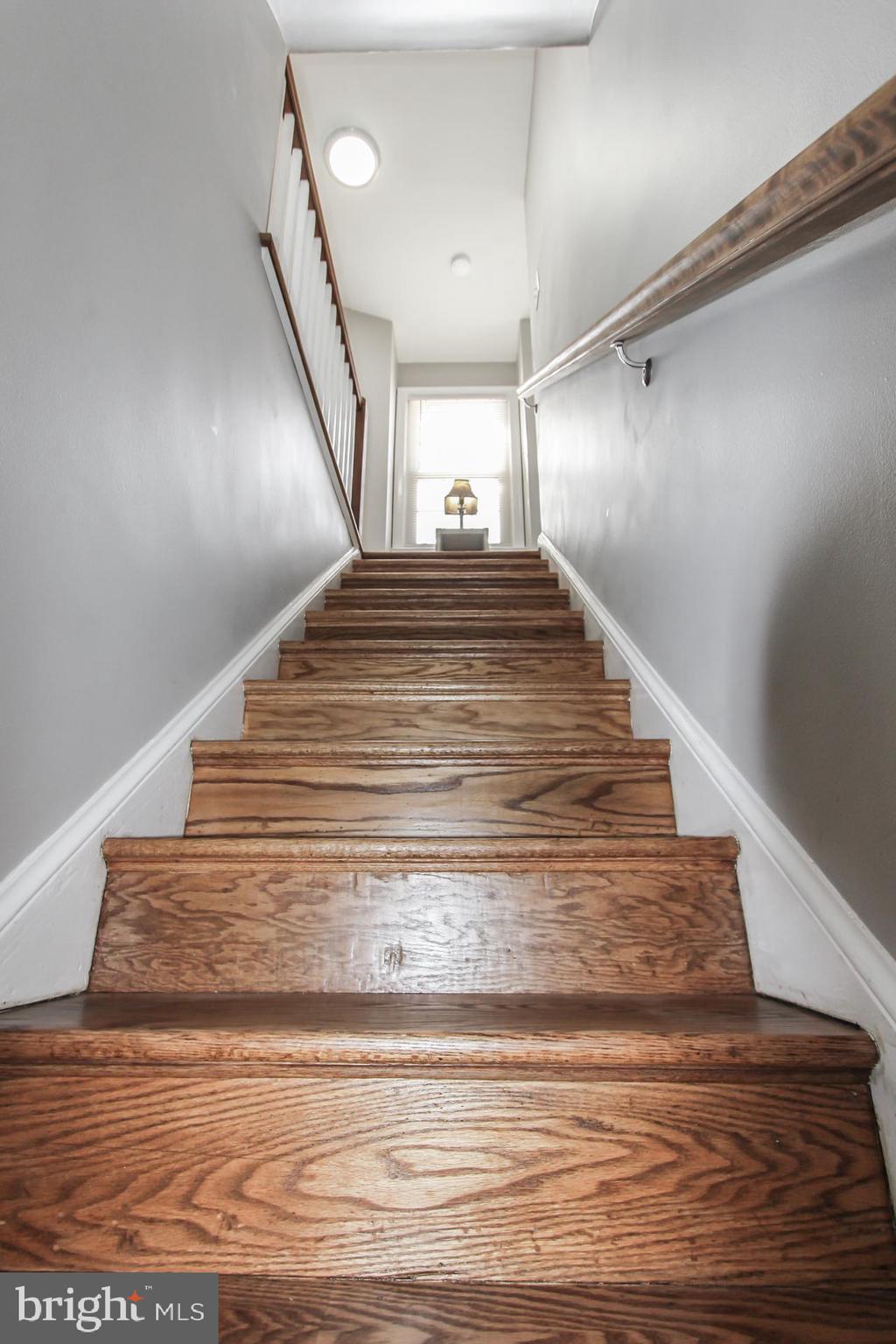 9108 Eton Road Silver Spring, MD 20901 - Photo 13 of 43 Refinished stairs up to second level.