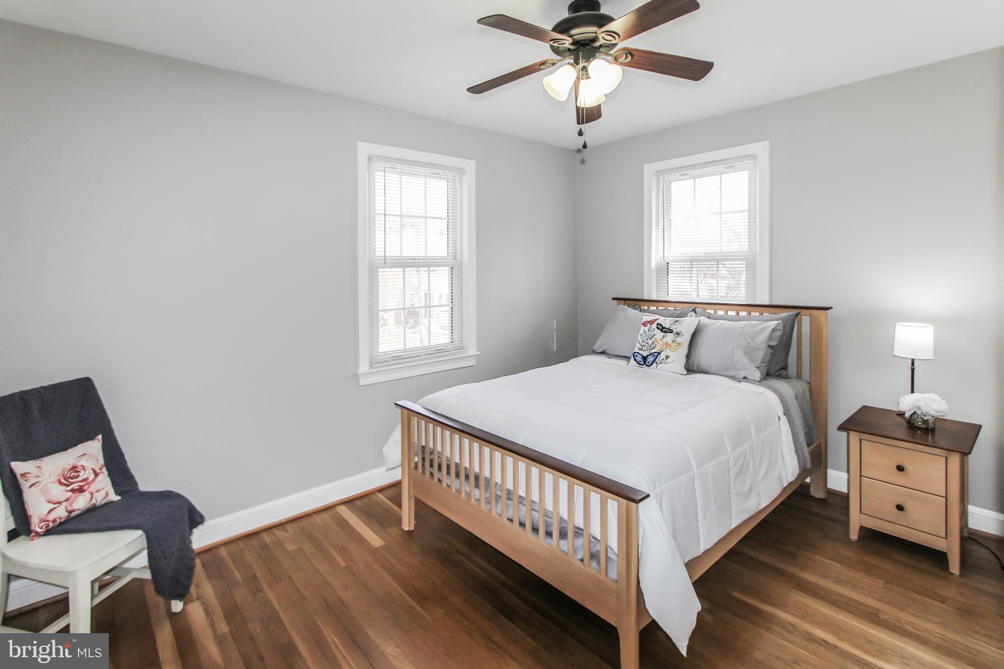 9108 Eton Road Silver Spring, MD 20901 - Photo 19 of 43 Bedroom 2 w/ HW floors, fresh paint & fan/lights.