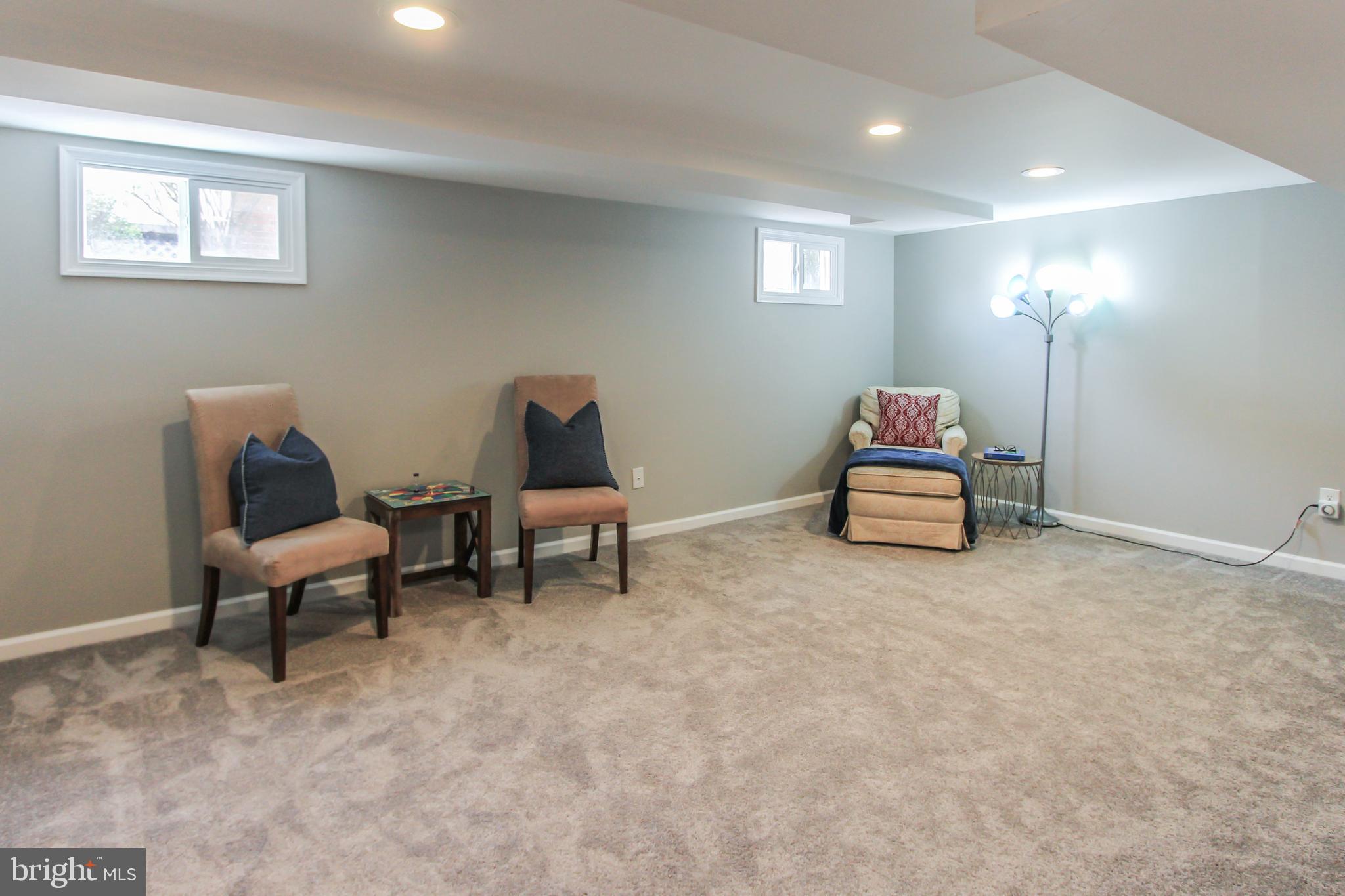 9108 Eton Road Silver Spring, MD 20901 - Photo 30 of 43 Large recreation room w/ new windows.