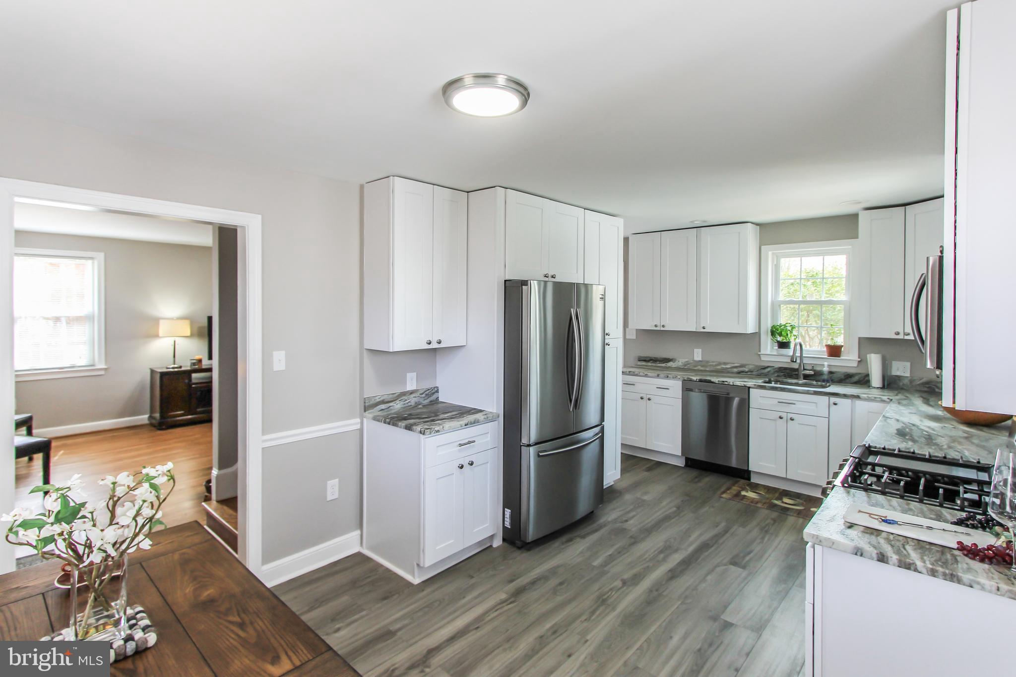 9108 Eton Road Silver Spring, MD 20901 - Photo 5 of 43 New 42" white cabinets w/ pantry cabinet.
