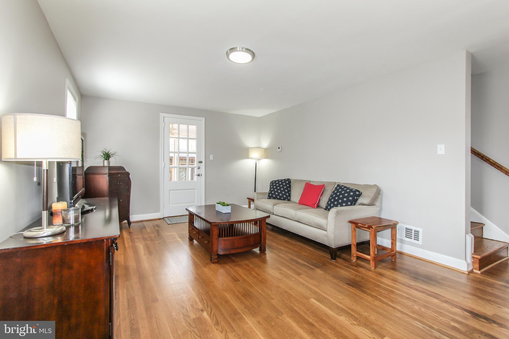 9108 Eton Road Silver Spring, MD 20901 - Photo 9 of 43 Living room-access to screened porch & backyard.