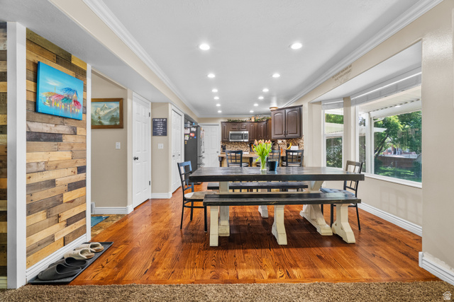 5727 South 3550th Street West Roy, UT 84067 - Photo 19 of 49 Dining area featuring hardwood flooring, recessed lighting, and a bay window