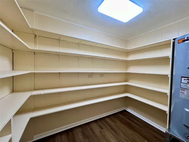 a storage room with wooden floor