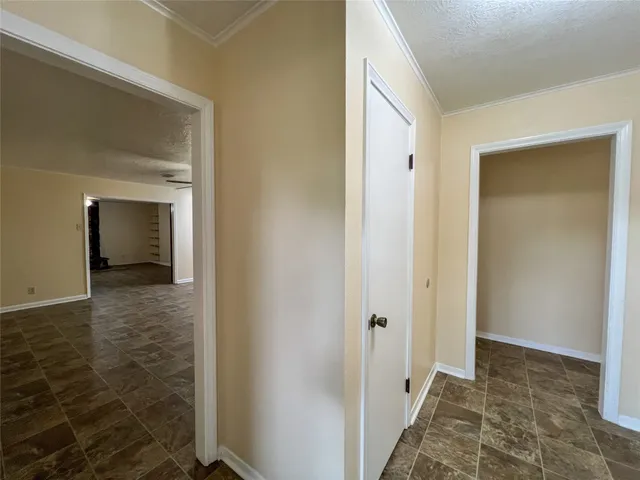 a view of a bathroom from a hallway