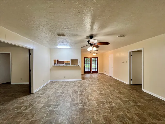 a view of a hallway with a kitchen