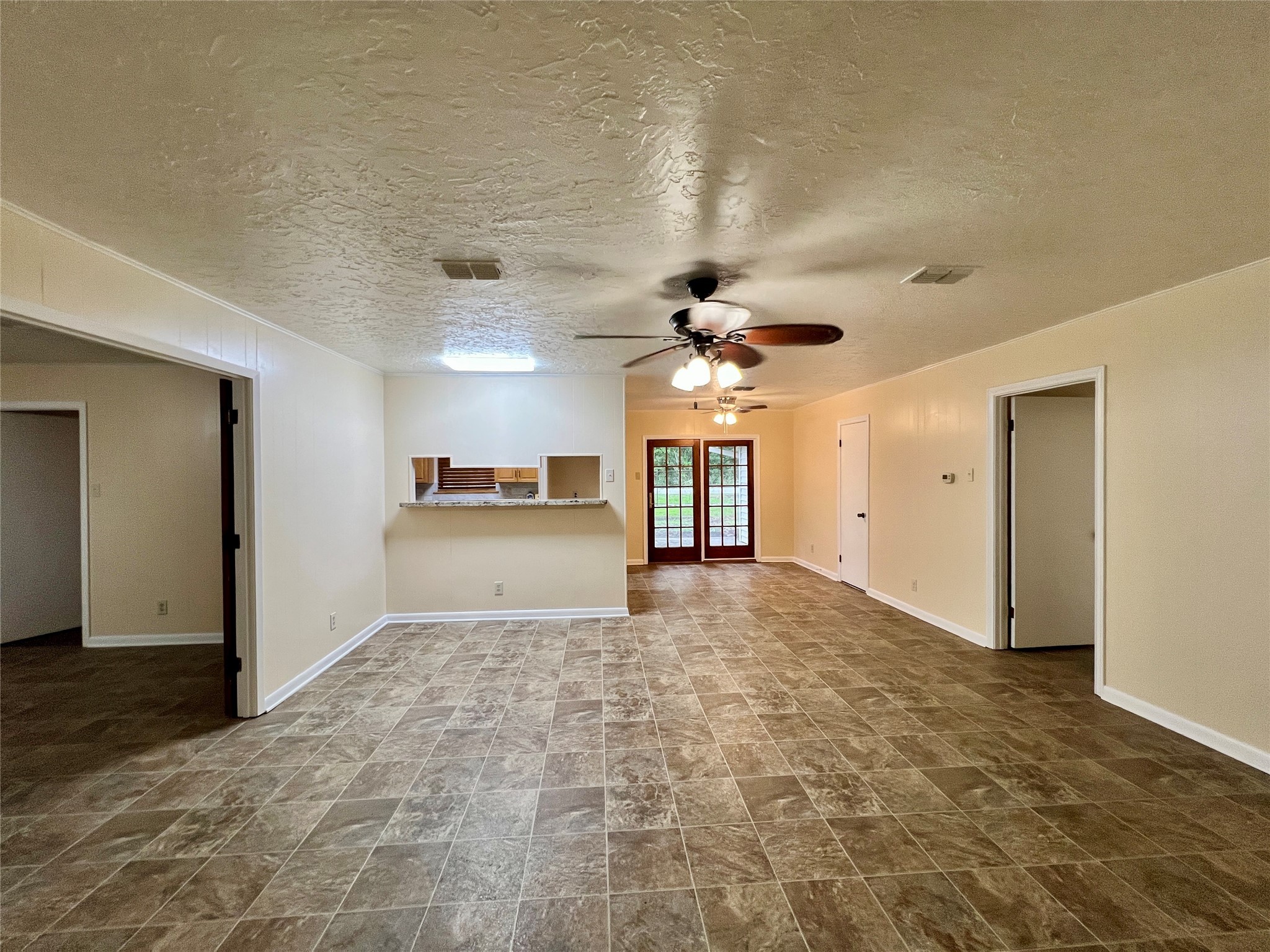 8610 Overhill Lane Beaumont, TX 77707 - Photo 6 of 20 a view of a hallway with a kitchen