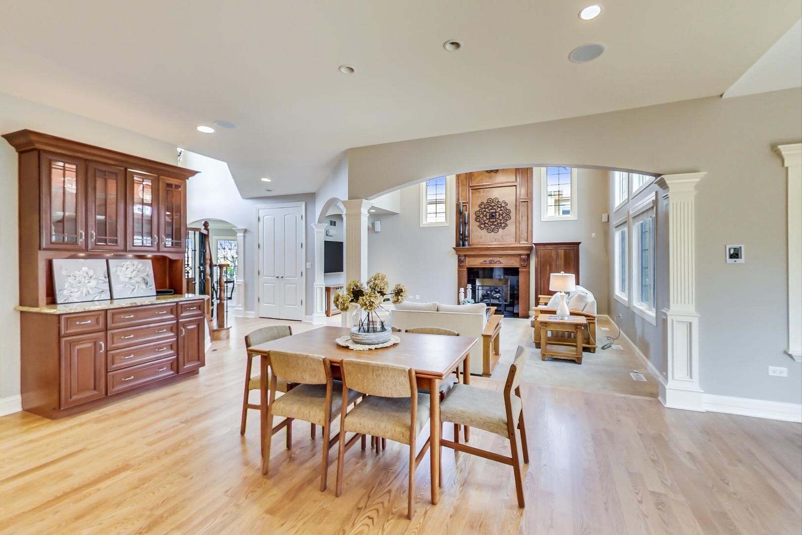 3312 Keller Lane Naperville, IL 60565 - Photo 15 of 50 a view of a dining room with furniture window and wooden floor