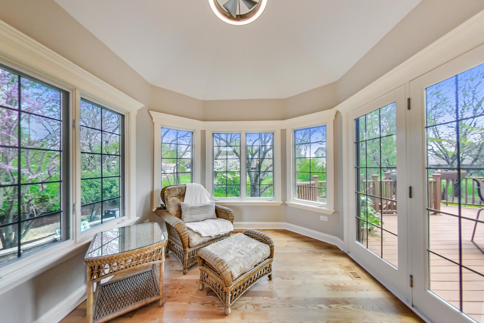 3312 Keller Lane Naperville, IL 60565 - Photo 17 of 50 a living room with furniture and a floor to ceiling window
