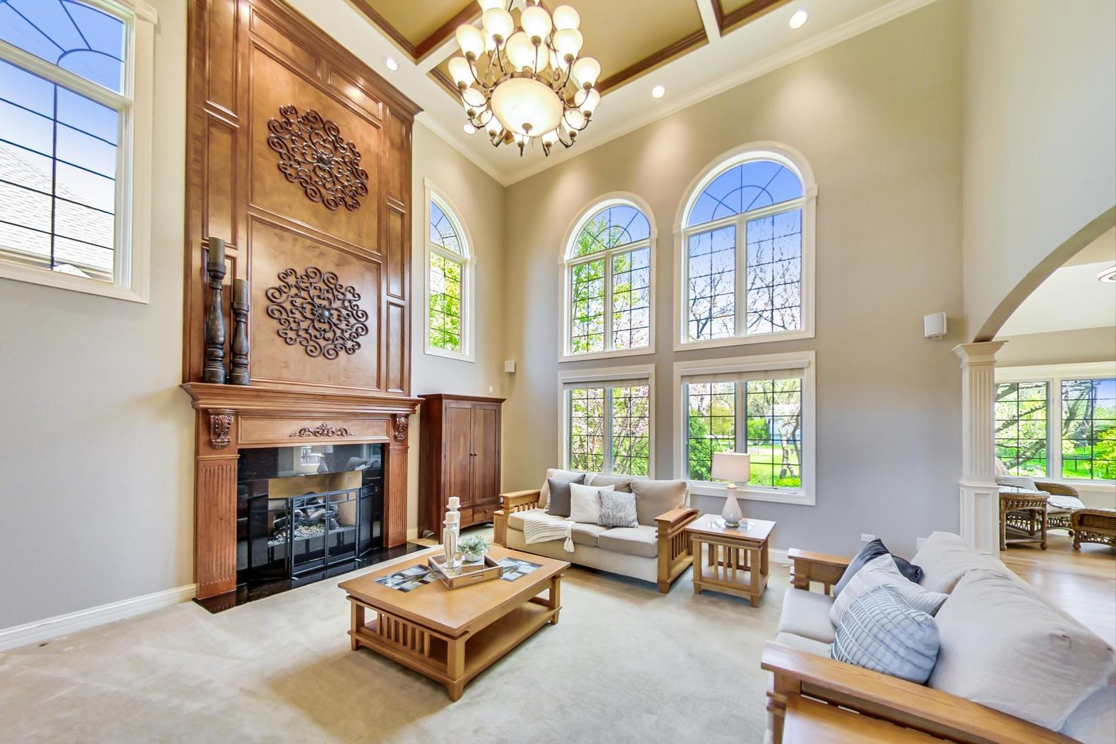 3312 Keller Lane Naperville, IL 60565 - Photo 19 of 50 a living room with furniture a fireplace and a large window