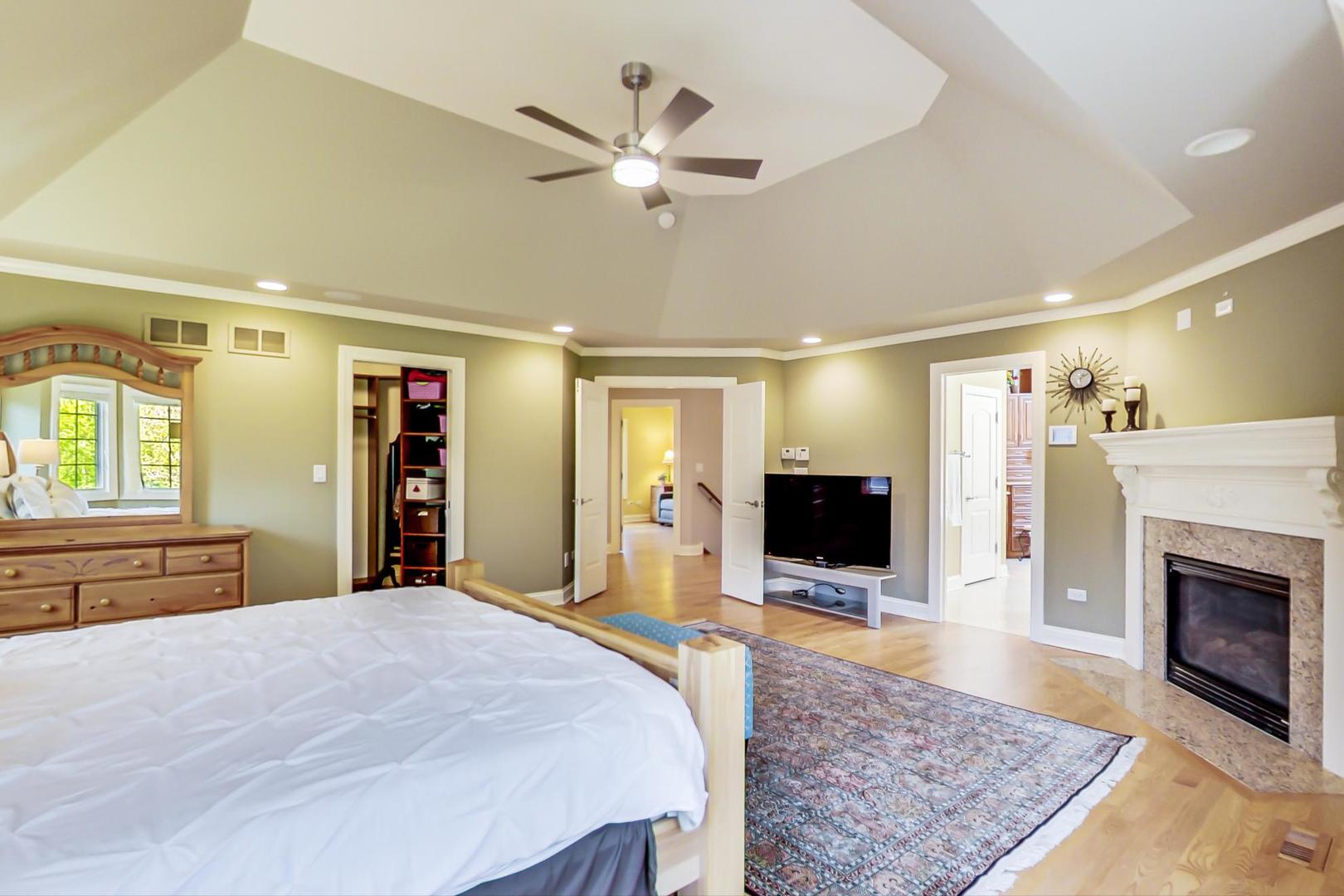 3312 Keller Lane Naperville, IL 60565 - Photo 25 of 50 a bedroom with a bed and a flat screen tv