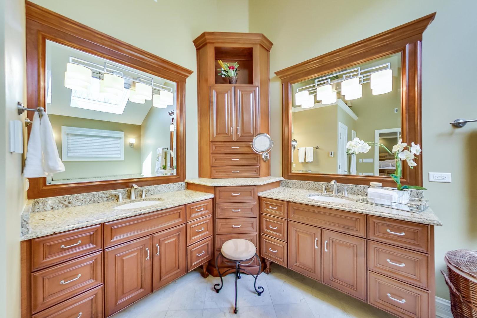 3312 Keller Lane Naperville, IL 60565 - Photo 26 of 50 a bathroom with a granite countertop sink a large mirror and a window