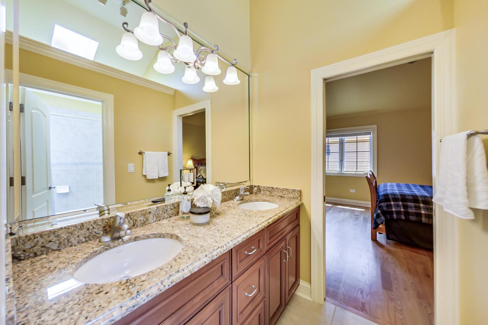 3312 Keller Lane Naperville, IL 60565 - Photo 30 of 50 a spacious bathroom with a granite countertop double vanity sink and a mirror