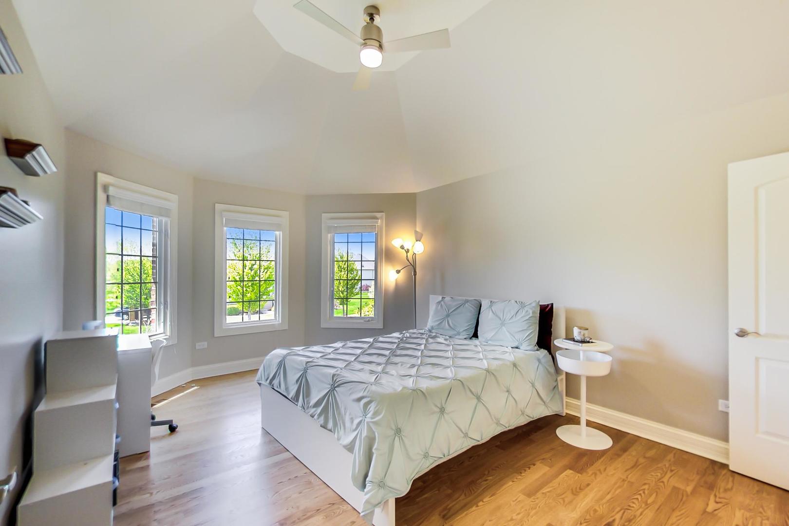 3312 Keller Lane Naperville, IL 60565 - Photo 33 of 50 a bedroom with a bed and windows