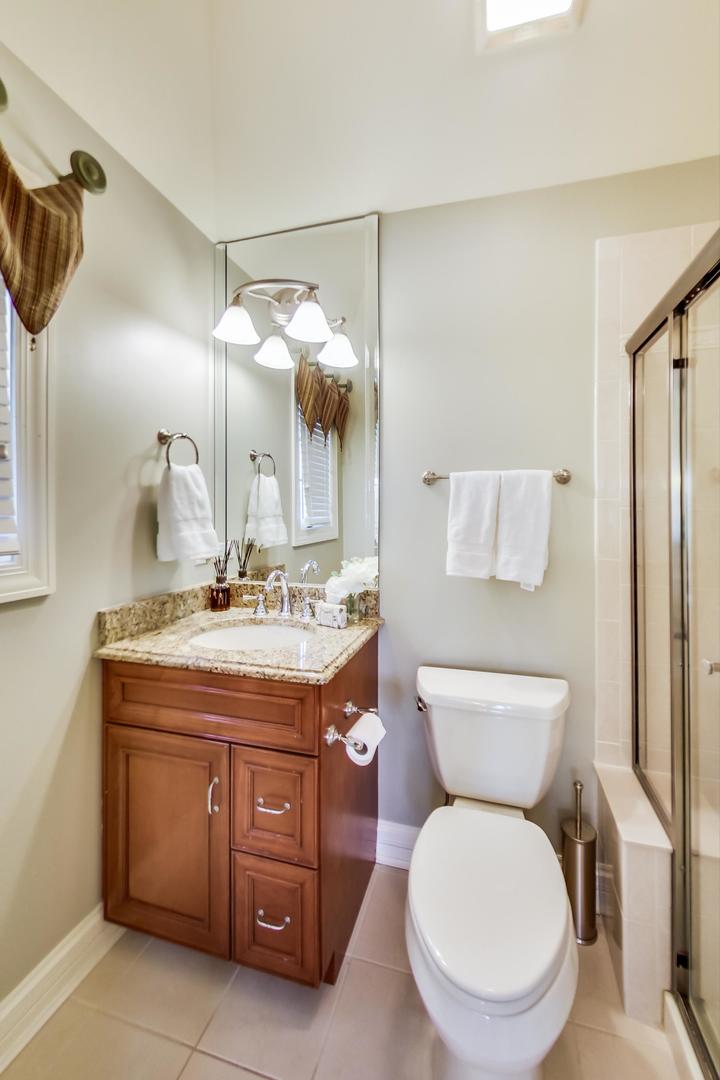 3312 Keller Lane Naperville, IL 60565 - Photo 34 of 50 a bathroom with a granite countertop toilet sink and mirror