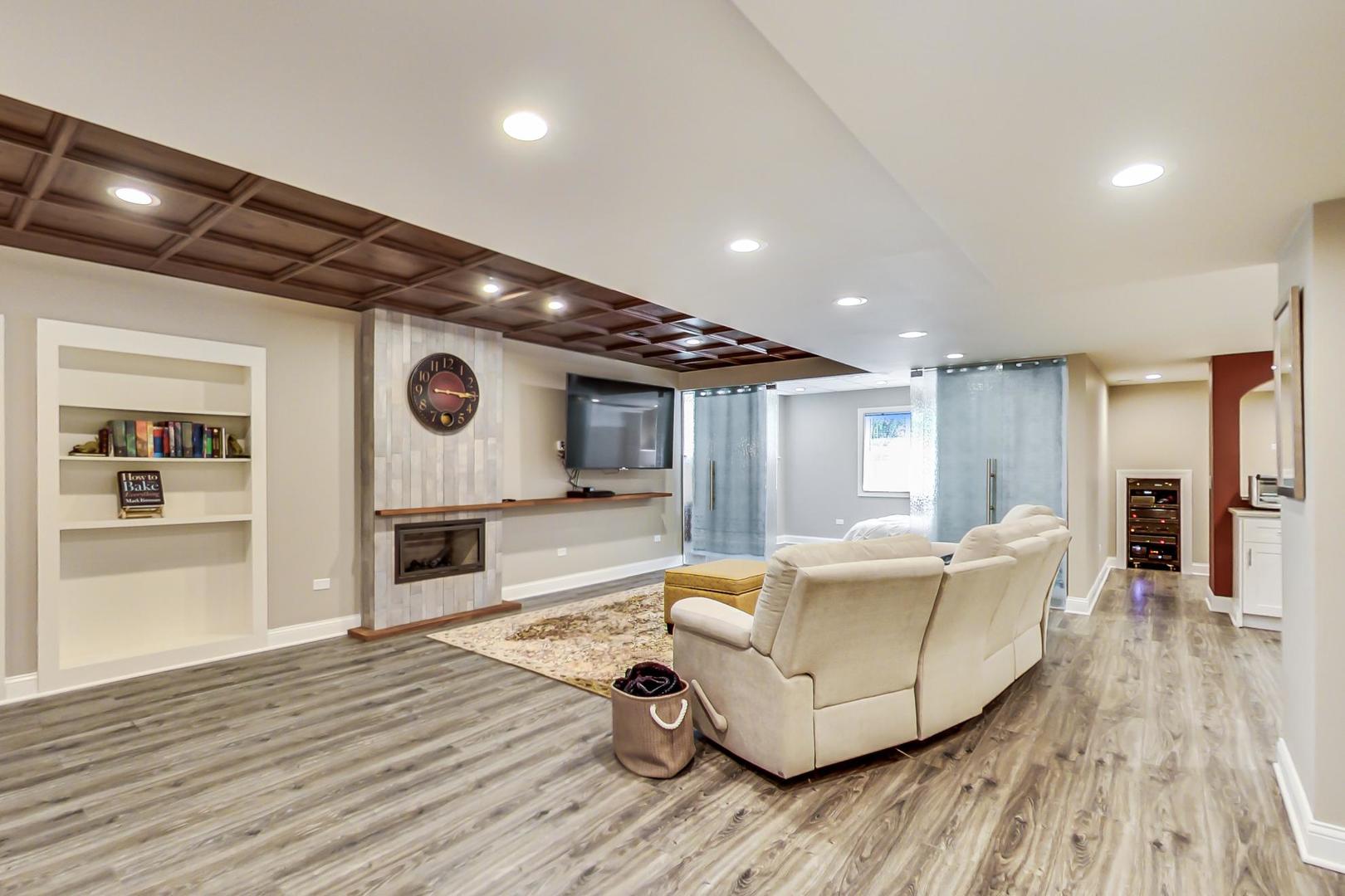 3312 Keller Lane Naperville, IL 60565 - Photo 36 of 50 a living room with furniture and a wooden floor