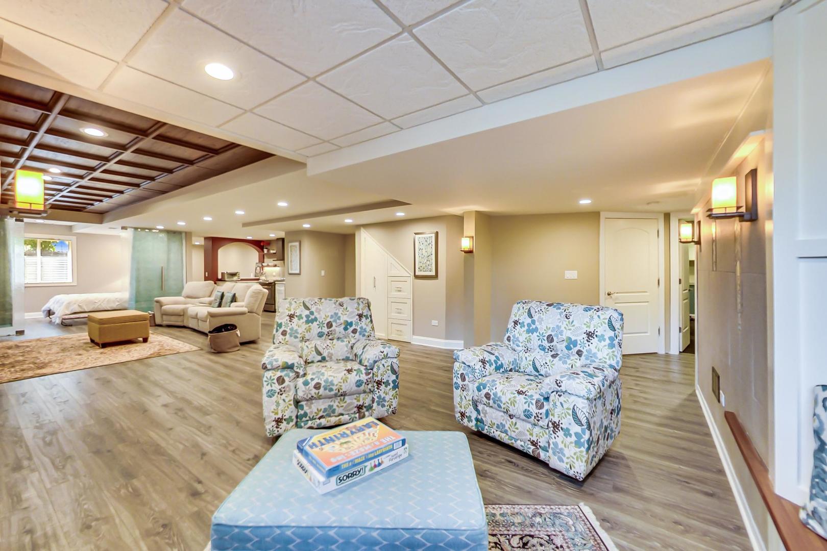 3312 Keller Lane Naperville, IL 60565 - Photo 38 of 50 a living room with furniture and a chandelier