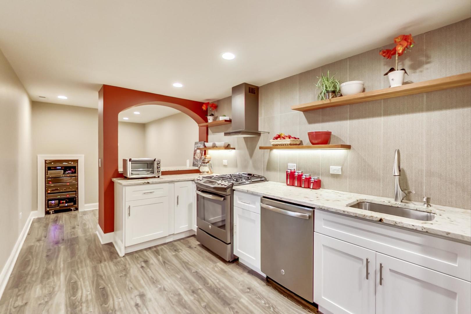 3312 Keller Lane Naperville, IL 60565 - Photo 39 of 50 a kitchen with a sink dishwasher and white cabinets with wooden floor