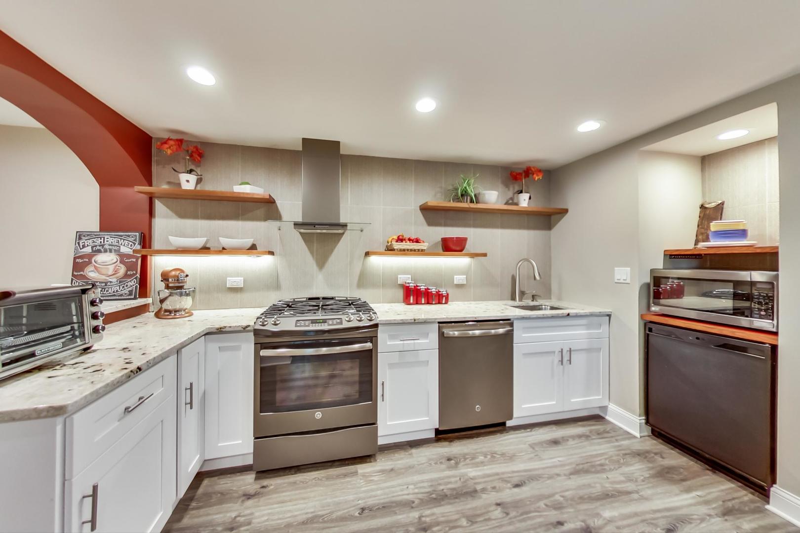 3312 Keller Lane Naperville, IL 60565 - Photo 40 of 50 a kitchen with stainless steel appliances granite countertop a stove and a sink