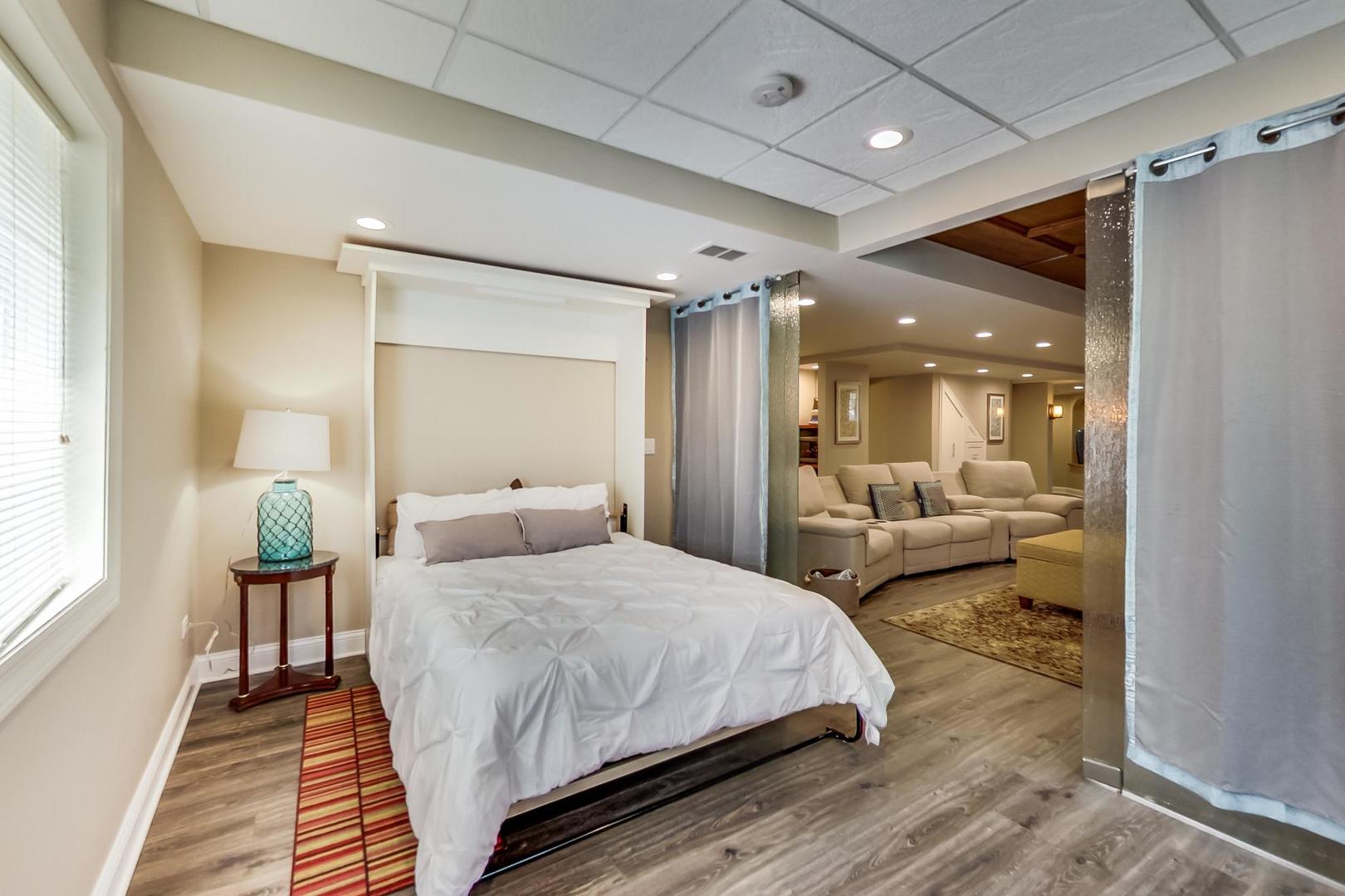 3312 Keller Lane Naperville, IL 60565 - Photo 42 of 50 a bedroom with a bed and a large mirror