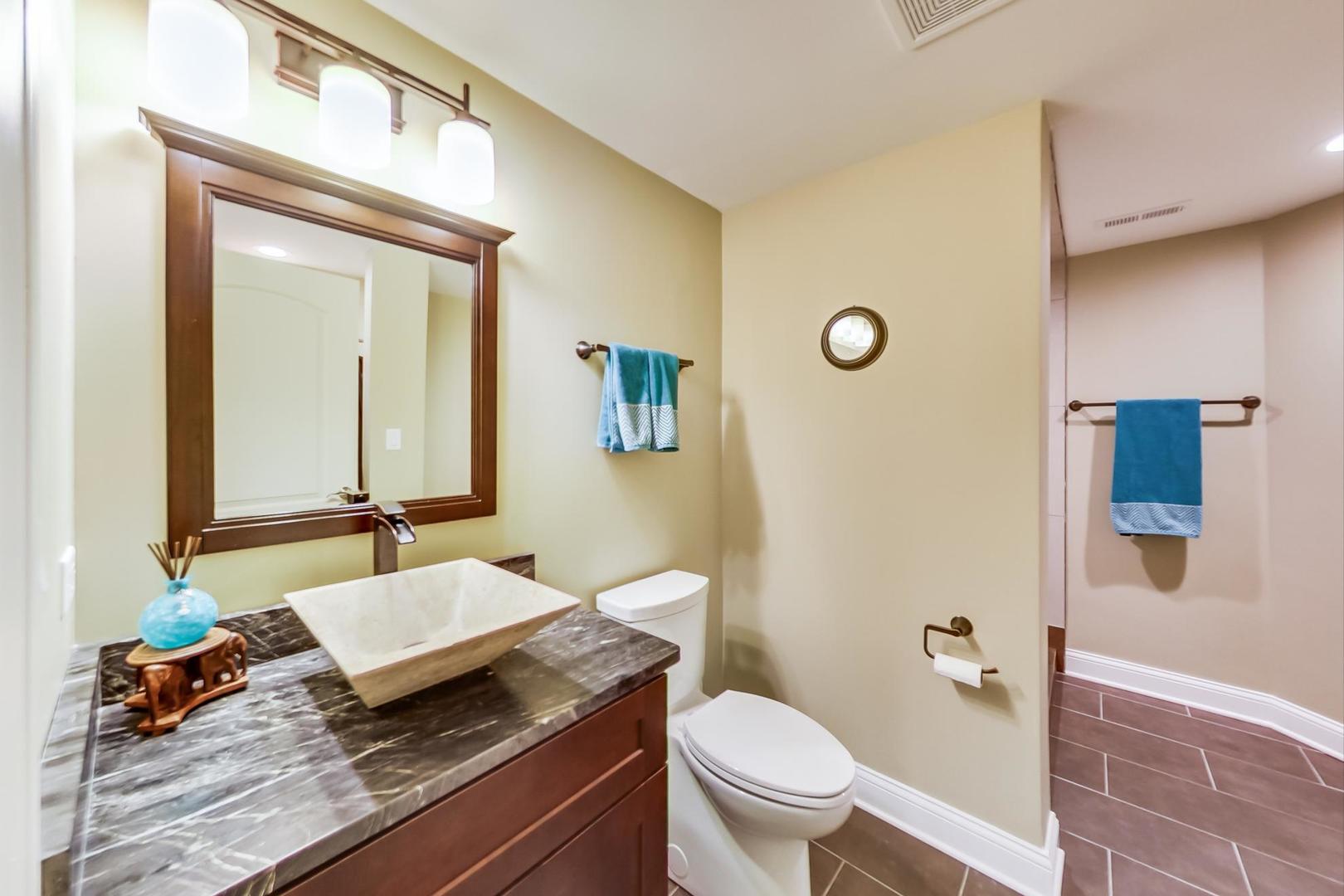 3312 Keller Lane Naperville, IL 60565 - Photo 43 of 50 a bathroom with a granite countertop sink a toilet and a mirror