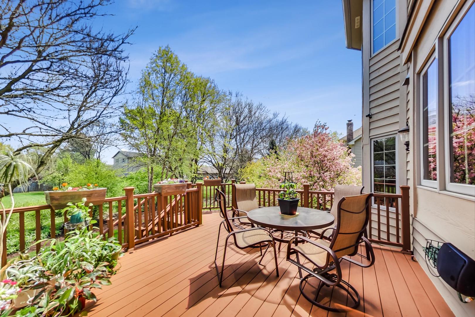 3312 Keller Lane Naperville, IL 60565 - Photo 46 of 50 a view of a patio with table and chairs and wooden floor