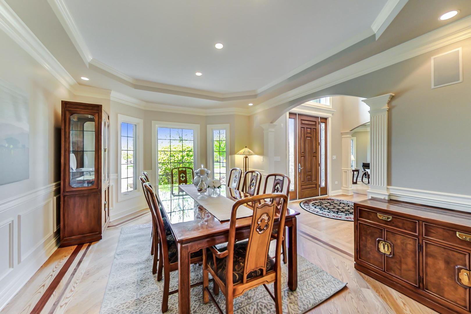 3312 Keller Lane Naperville, IL 60565 - Photo 9 of 50 a view of a dining room with furniture window and wooden floor
