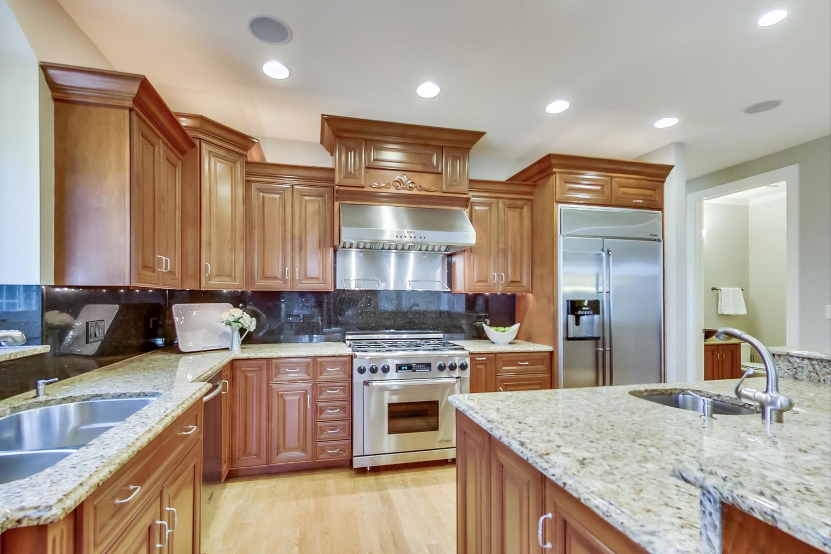 3312 Keller Lane Naperville, IL 60565 - Photo 10 of 50 a kitchen with a stove and a wooden cabinets