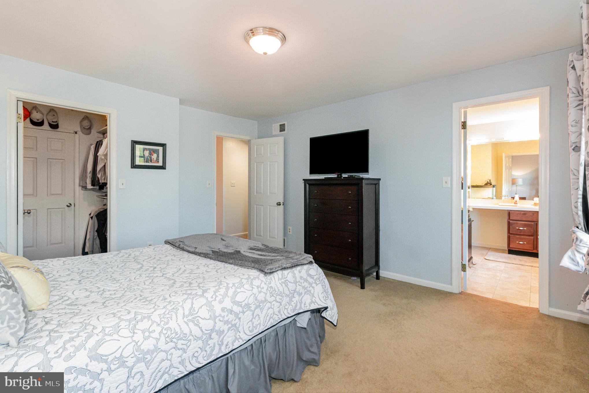 124 South Ridge Road Boiling Springs, PA 17007 - Photo 20 of 56 a bedroom with a bed and a flat screen tv