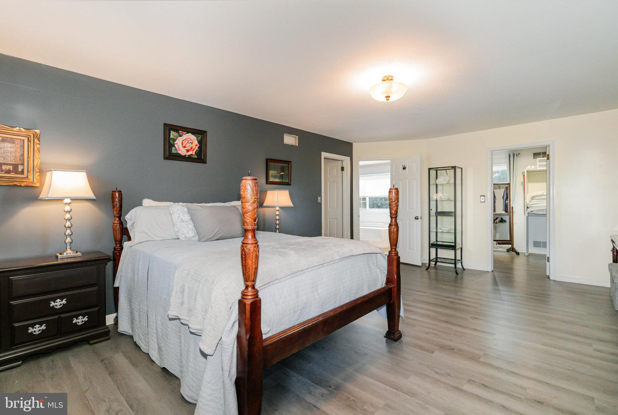 124 South Ridge Road Boiling Springs, PA 17007 - Photo 27 of 56 a spacious bedroom with a bed and wooden floor