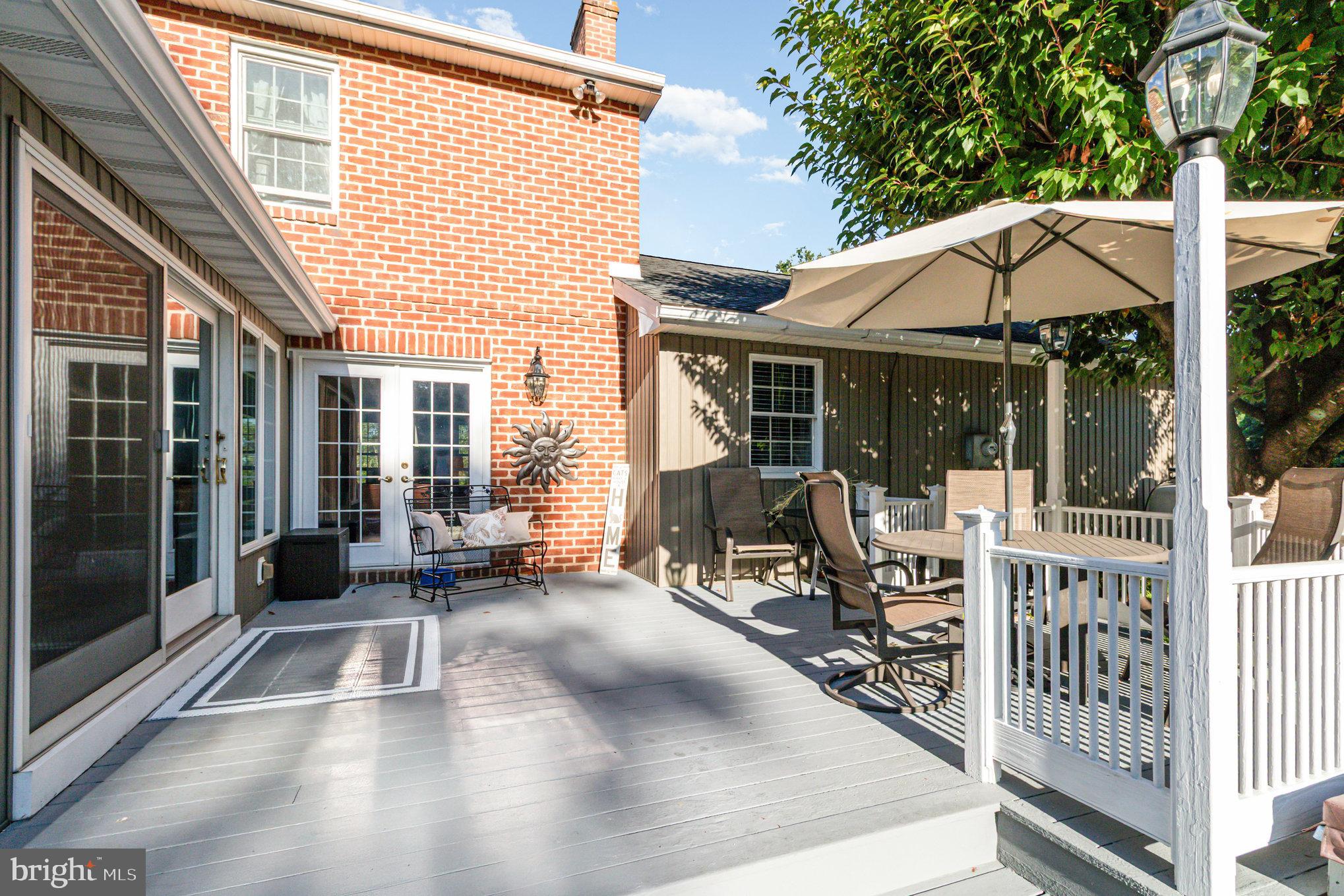 124 South Ridge Road Boiling Springs, PA 17007 - Photo 34 of 56 a view of a patio with table and chairs and wooden floor