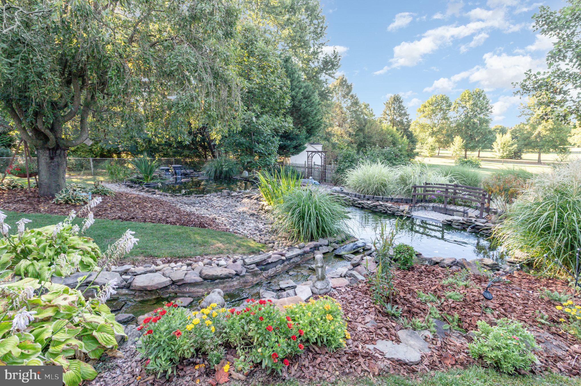 124 South Ridge Road Boiling Springs, PA 17007 - Photo 44 of 56 a view of a garden with flowers and trees