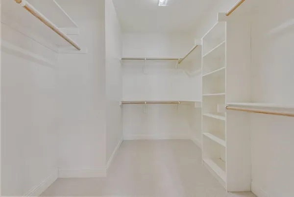 a view of an empty walk in closet