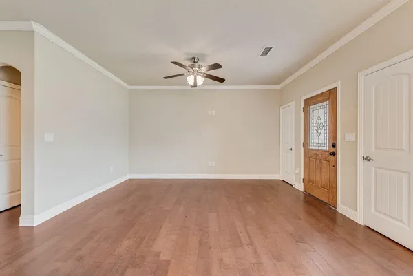 a view of an empty room with a window