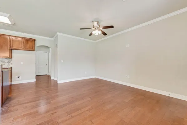 an empty room with fan and a ceiling fan