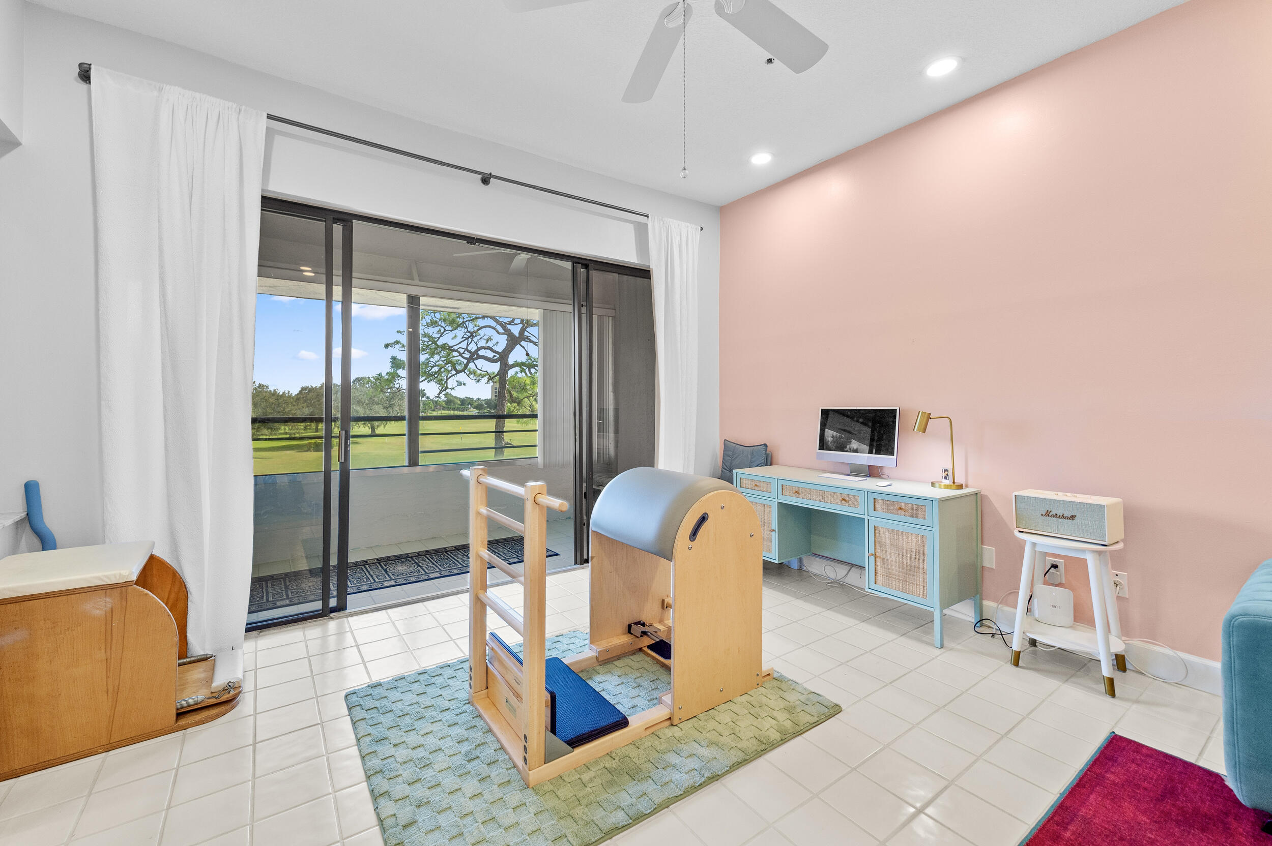 7460 La Paz Boulevard, Unit 304 Boca Raton, FL 33433 - Photo 20 of 37 a work room with furniture a rug potted plant and a large window